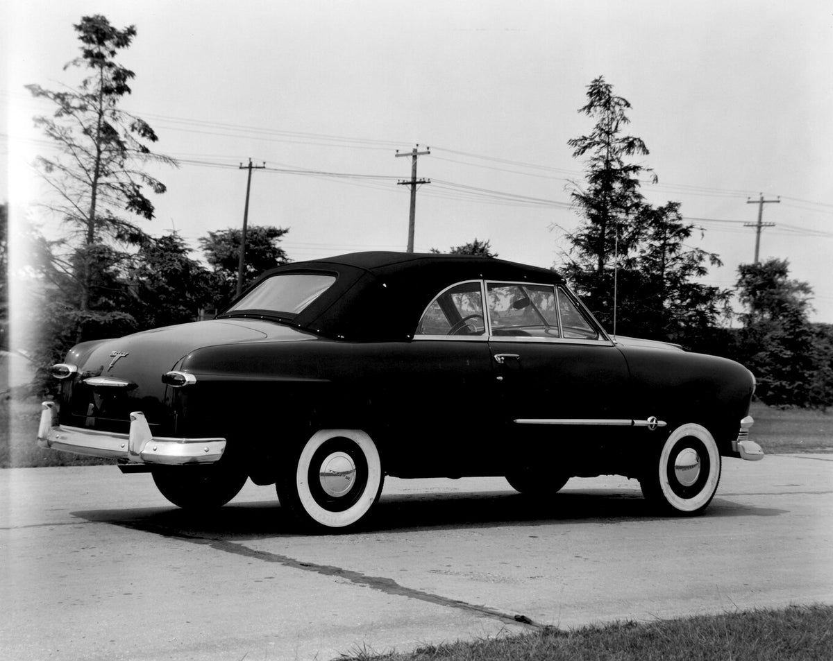 This archival image documents the 1951 Meteor Convertible rear view on scenic road with trees AR-2007-5 and is preserved in the Ford Heritage Vault as part of Ford Motor Company's historic photographic archive. Free for personal, non-commercial us...