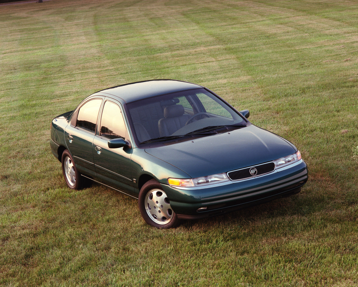This archival image documents the 1996 Mercury Mystique on Grass and is preserved in the Ford Heritage Vault as part of Ford Motor Company's historic photographic archive. Free for personal, non-commercial use. Ford Heritage Vault reference AR-200...