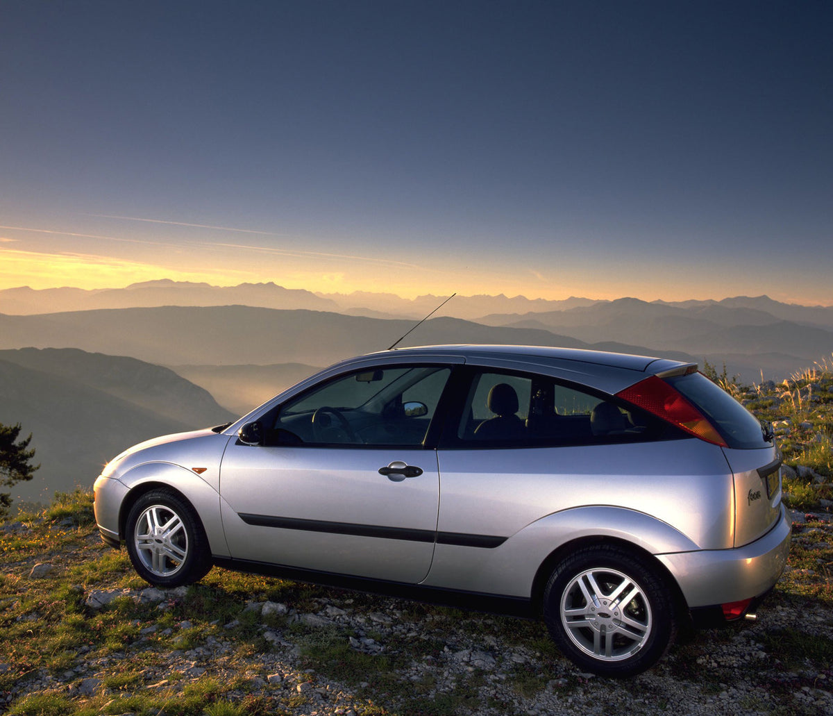 This archival image documents the 1998 Ford Focus rear view overlooking scenic mountains and is preserved in the Ford Heritage Vault as part of Ford Motor Company's historic photographic archive. Free for personal, non-commercial use. Ford Heritag...