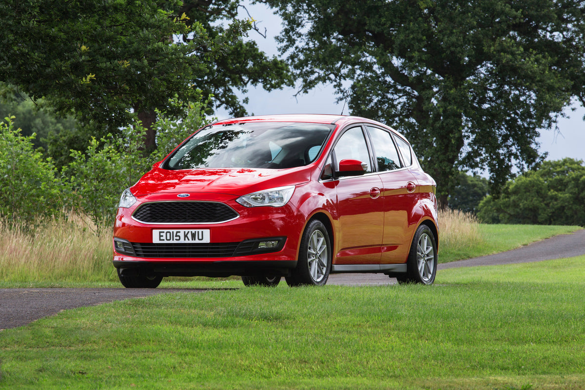 This archival image documents the 2015 Ford C-Max Mark II on scenic road with trees and is preserved in the Ford Heritage Vault as part of Ford Motor Company's historic photographic archive. Free for personal, non-commercial use. Ford Heritage Vau...