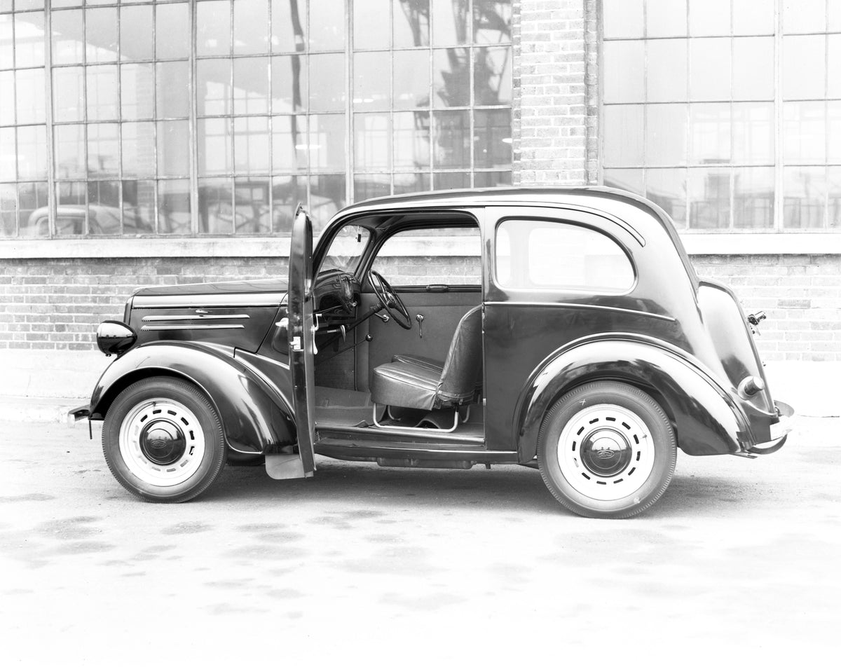 This archival image documents the 1946 Ford Anglia E04A side view with door open and is preserved in the Ford Heritage Vault as part of Ford Motor Company's historic photographic archive. Free for personal, non-commercial use. Ford Heritage Vault ...