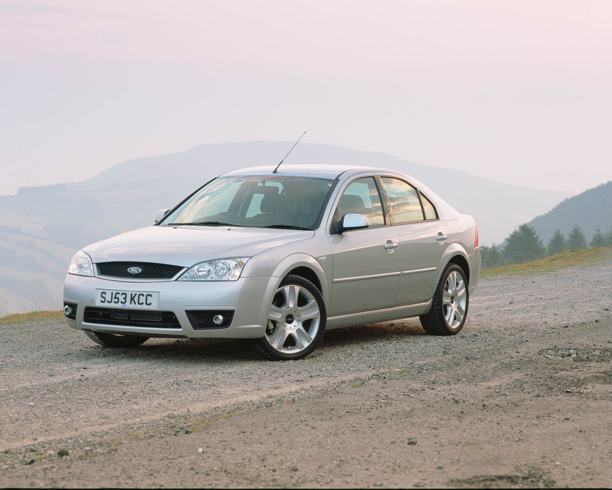 This archival image documents the 2003 Ford Mondeo Mark II on scenic road and is preserved in the Ford Heritage Vault as part of Ford Motor Company's historic photographic archive. Free for personal, non-commercial use. Ford Heritage Vault referen...