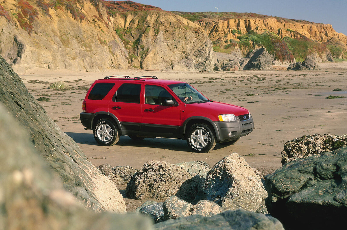 This archival image documents the 2003 Ford Maverick on scenic beach and is preserved in the Ford Heritage Vault as part of Ford Motor Company's historic photographic archive. Free for personal, non-commercial use. Ford Heritage Vault reference AR...