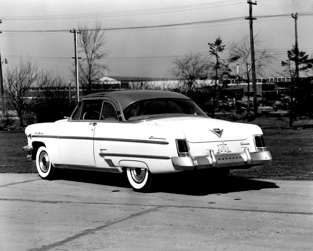 This archival image documents the 1954 Monarch Sun Valley Coupe rear view on scenic road with trees AR-2007-5 and is preserved in the Ford Heritage Vault as part of Ford Motor Company's historic photographic archive. Free for personal, non-commerc...