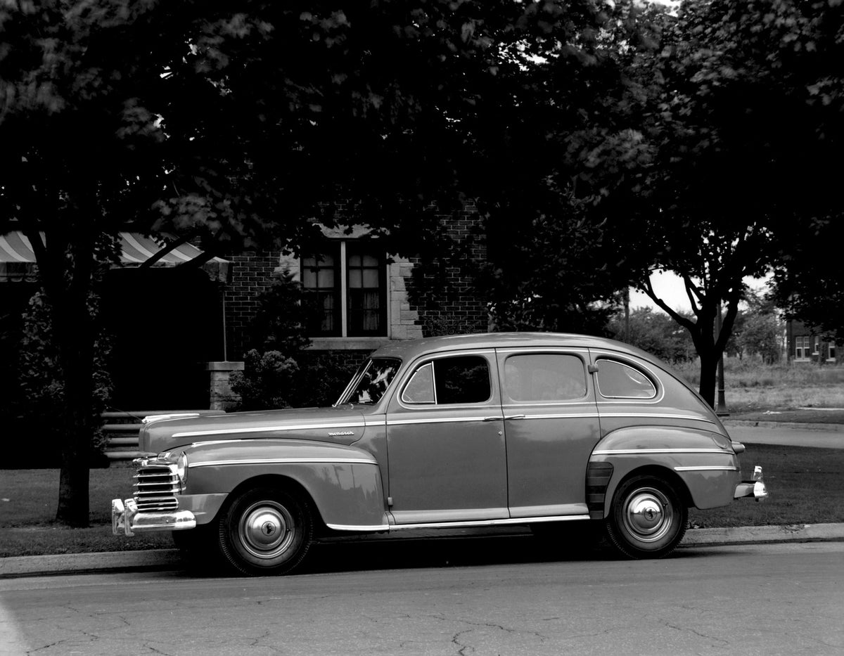 This archival image documents the 1946 Monarch Sedan side view on scenic street with trees AR-2007-5 and is preserved in the Ford Heritage Vault as part of Ford Motor Company's historic photographic archive. Free for personal, non-commercial use. ...
