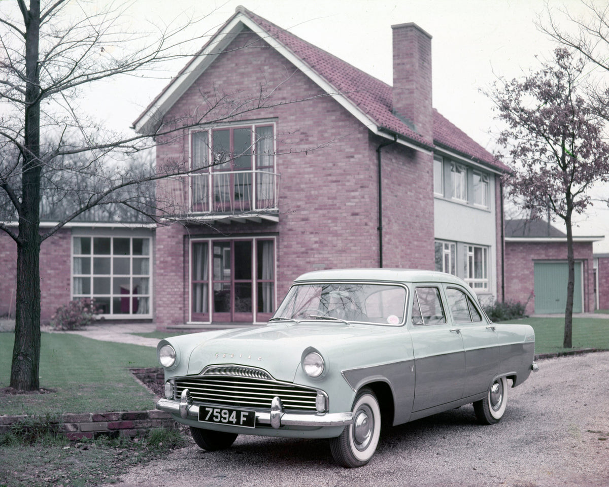 This archival image documents the 1957 Ford Zodiac Mark II on road in front of scenic house and is preserved in the Ford Heritage Vault as part of Ford Motor Company's historic photographic archive. Free for personal, non-commercial use. Ford Heri...