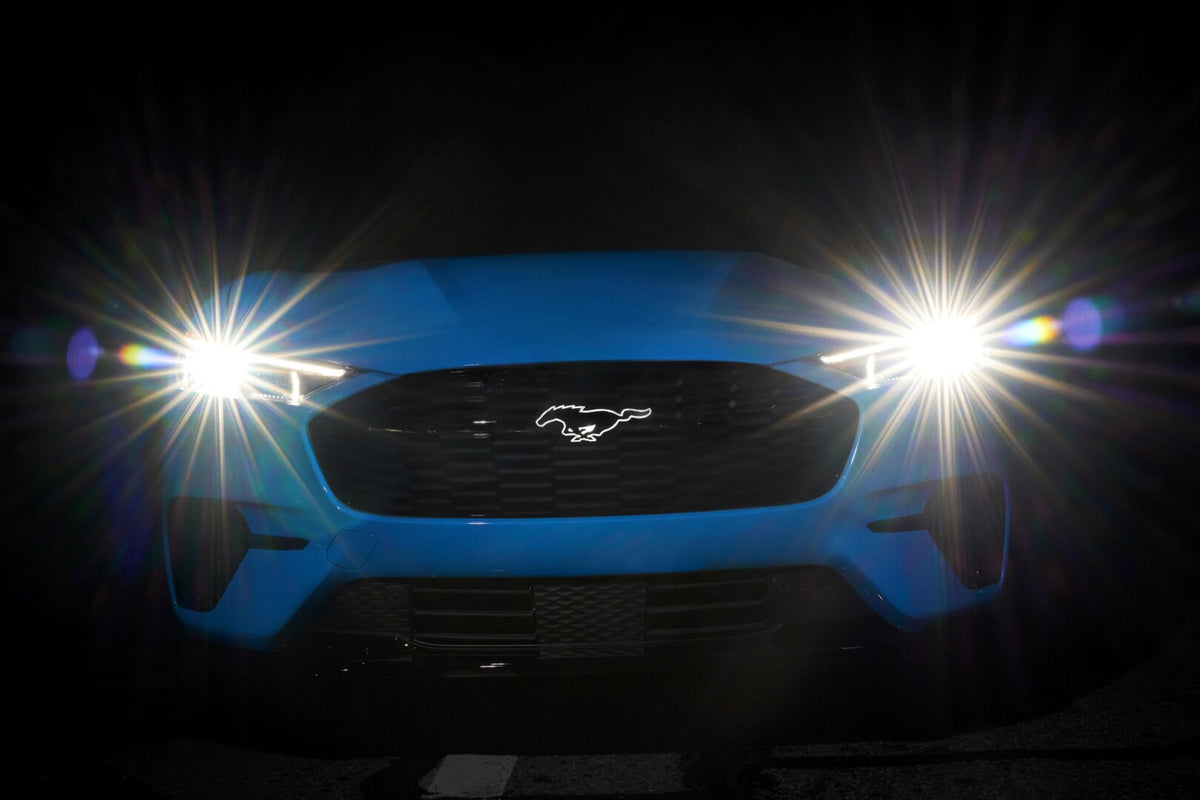 This archival image documents the 2023 Ford Mustang Mach-E front view with headlights on and is preserved in the Ford Heritage Vault as part of Ford Motor Company's historic photographic archive. Free for personal, non-commercial use. Ford Heritag...