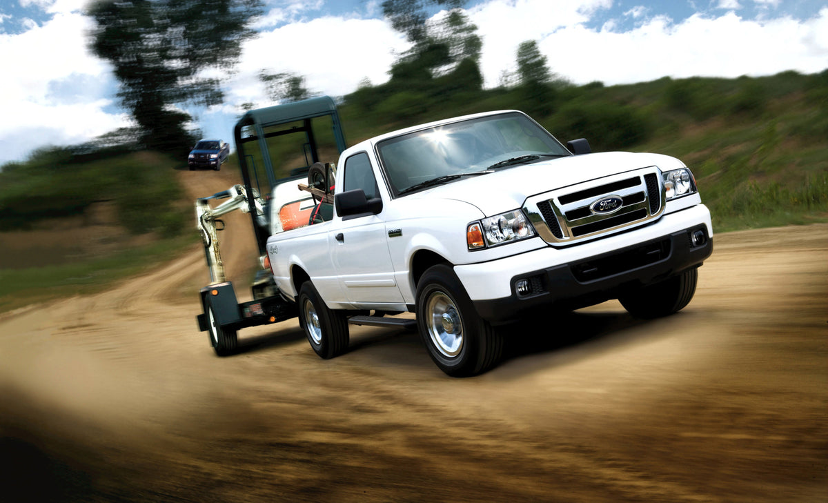 This archival image documents the 2007 Ford Ranger action shot towing trailer MS980935311 and is preserved in the Ford Heritage Vault as part of Ford Motor Company's historic photographic archive. Free for personal, non-commercial use. Ford Herita...