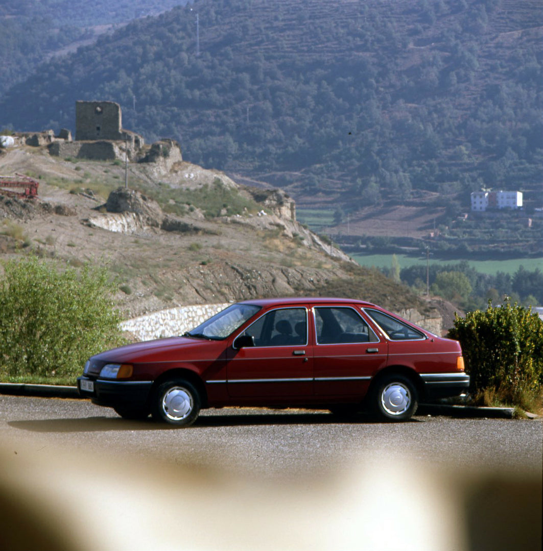 This archival image documents the 1986 Heritage Archive - 1987 1/2 Ford Sierra side view on scenic road in Spain and is preserved in the Ford Heritage Vault as part of Ford Motor Company's historic photographic archive. Free for personal, non-comm...