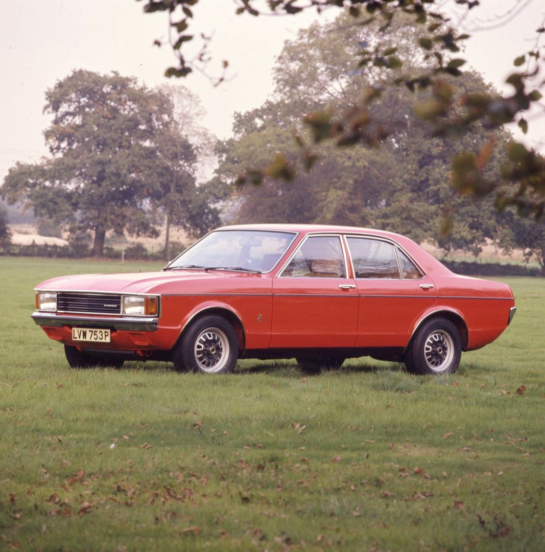 This archival image documents the 1975 Ford Granada Mark I L 2000 in scenic field with trees and is preserved in the Ford Heritage Vault as part of Ford Motor Company's historic photographic archive. Free for personal, non-commercial use. Ford Her...