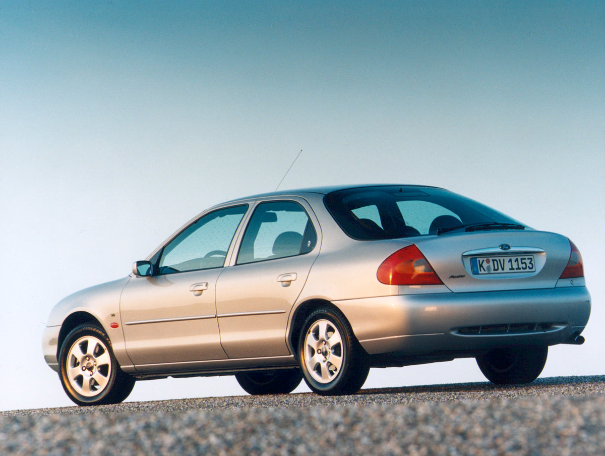 This archival image documents the 1998 Ford Mondeo Mark II Ghia rear view with scenic blue sky and is preserved in the Ford Heritage Vault as part of Ford Motor Company's historic photographic archive. Free for personal, non-commercial use. Ford H...