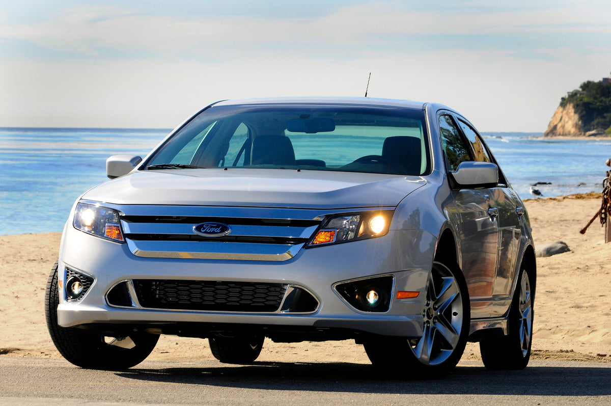 This archival image documents the 2010 Ford Fusion on beach and is preserved in the Ford Heritage Vault as part of Ford Motor Company's historic photographic archive. Free for personal, non-commercial use. Ford Heritage Vault reference AR-2008-8.1...