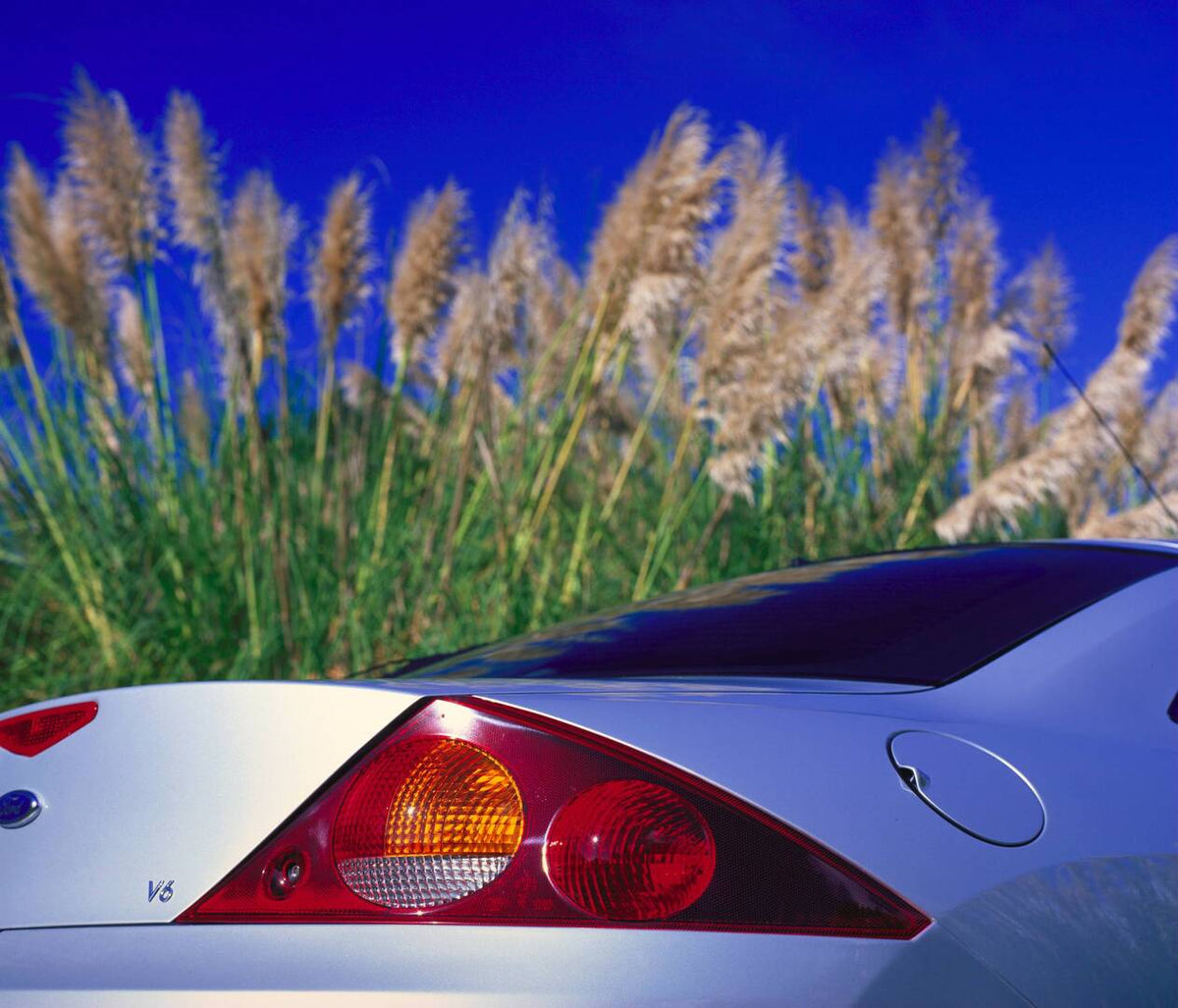 This archival image documents the 1998 Ford Cougar rear closeup with scenic plants AR-2002-213709 and is preserved in the Ford Heritage Vault as part of Ford Motor Company's historic photographic archive. Free for personal, non-commercial use. For...