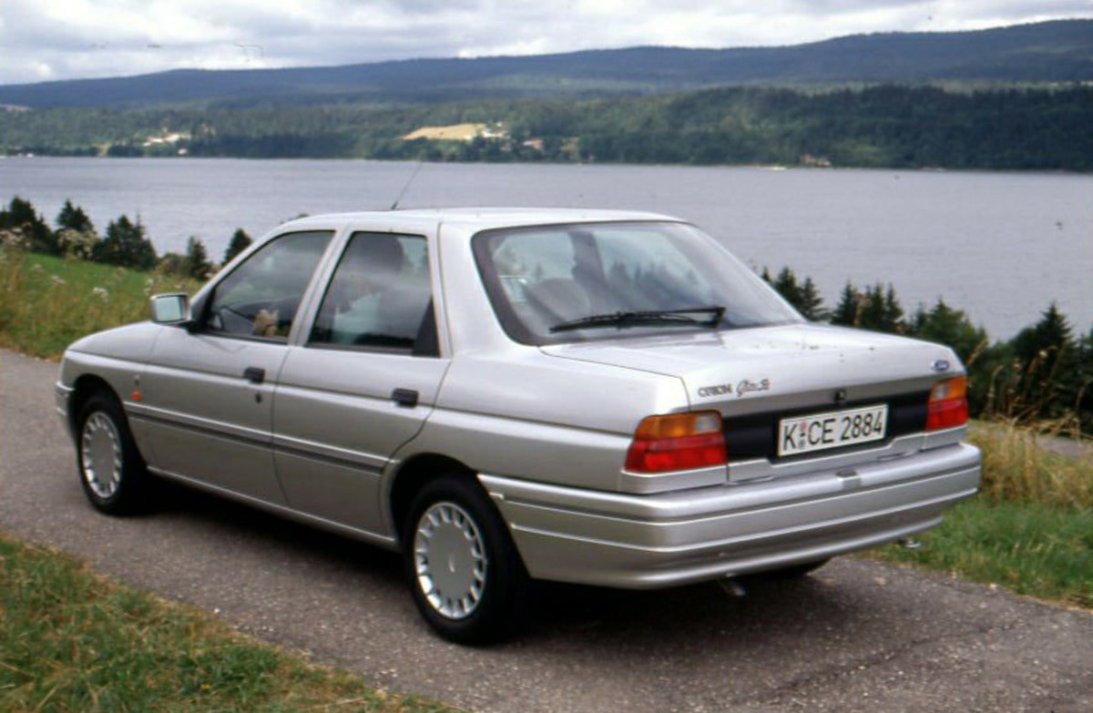 This archival image documents the 1990 Ford Orion Ghia S Mark III on scenic road in Geneva, Switzerland and is preserved in the Ford Heritage Vault as part of Ford Motor Company's historic photographic archive. Free for personal, non-commercial us...