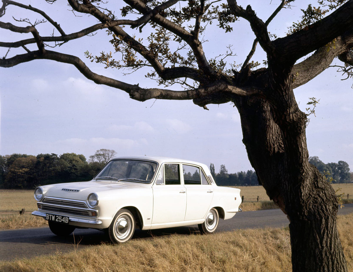 This archival image documents the 1965 Ford Cortina GT MK I on scenic road and is preserved in the Ford Heritage Vault as part of Ford Motor Company's historic photographic archive. Free for personal, non-commercial use. Ford Heritage Vault refere...