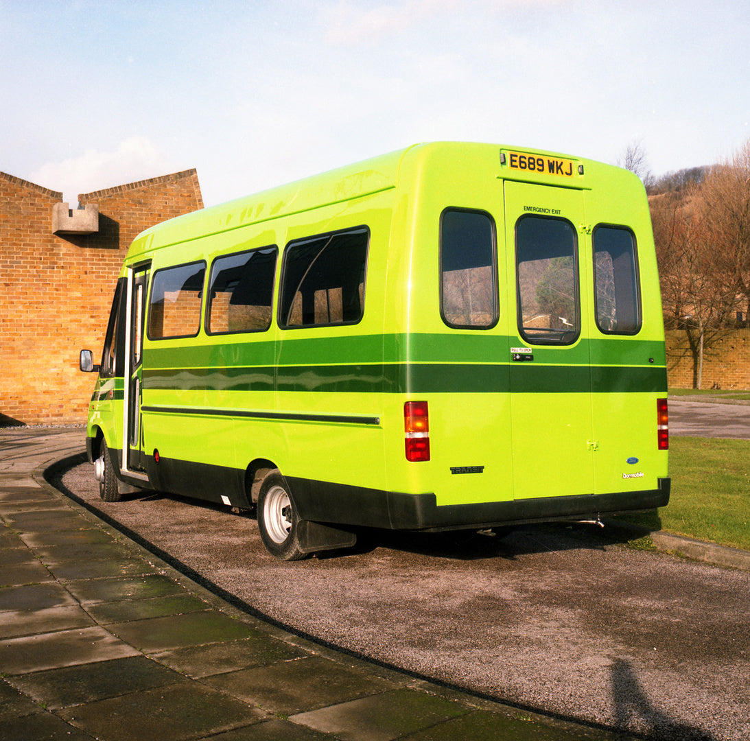 This archival image documents the 1988 Ford Transit Mark III Bus rear view in front of brick building in Folkstone and is preserved in the Ford Heritage Vault as part of Ford Motor Company's historic photographic archive. Free for personal, non-co...