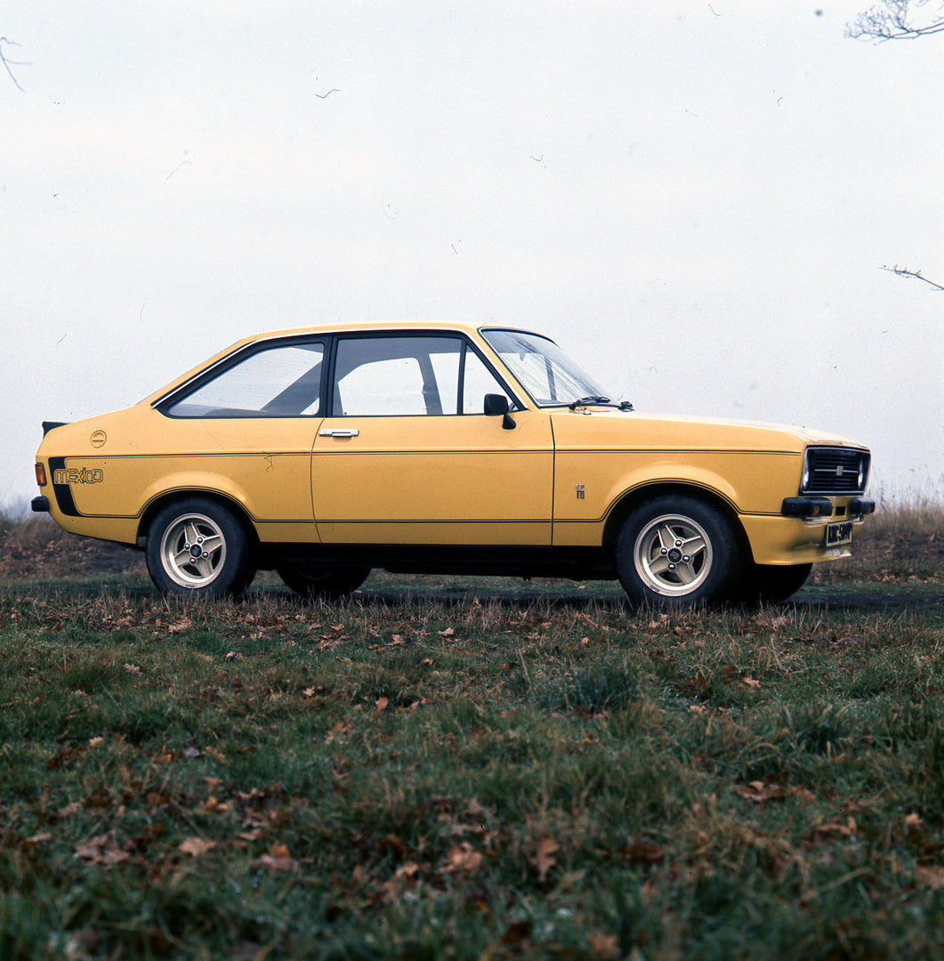 This archival image documents the 1975 Escort Mexico Mark II in scenic field and is preserved in the Ford Heritage Vault as part of Ford Motor Company's historic photographic archive. Free for personal, non-commercial use. Ford Heritage Vault refe...