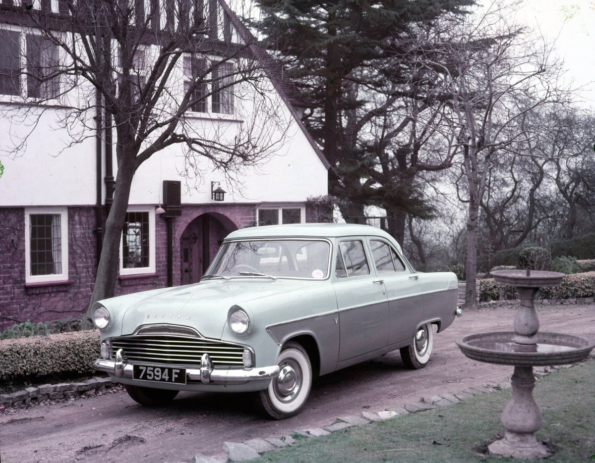 This archival image documents the 1957 Ford Zodiac Mark II in driveway of scenic house with fountain and is preserved in the Ford Heritage Vault as part of Ford Motor Company's historic photographic archive. Free for personal, non-commercial use. ...