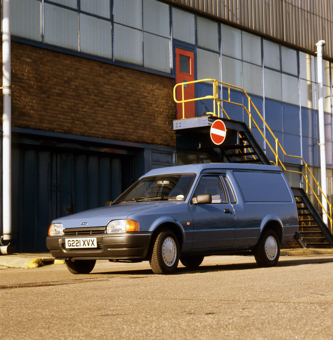 This archival image documents the 1989 Ford Escort Mark IV 6/8 Counterweight 55 Van in front of building and is preserved in the Ford Heritage Vault as part of Ford Motor Company's historic photographic archive. Free for personal, non-commercial u...