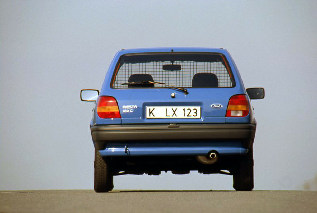 This archival image documents the 1989 Ford Fiesta Mark III Van rear view with scenic blue sky and is preserved in the Ford Heritage Vault as part of Ford Motor Company's historic photographic archive. Free for personal, non-commercial use. Ford H...