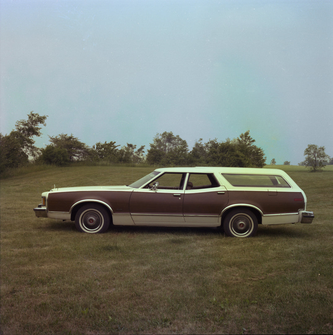 This archival image documents the 1977 Mercury Cougar Villager station wagon side-view scenic and is preserved in the Ford Heritage Vault as part of Ford Motor Company's historic photographic archive. Free for personal, non-commercial use. Ford He...