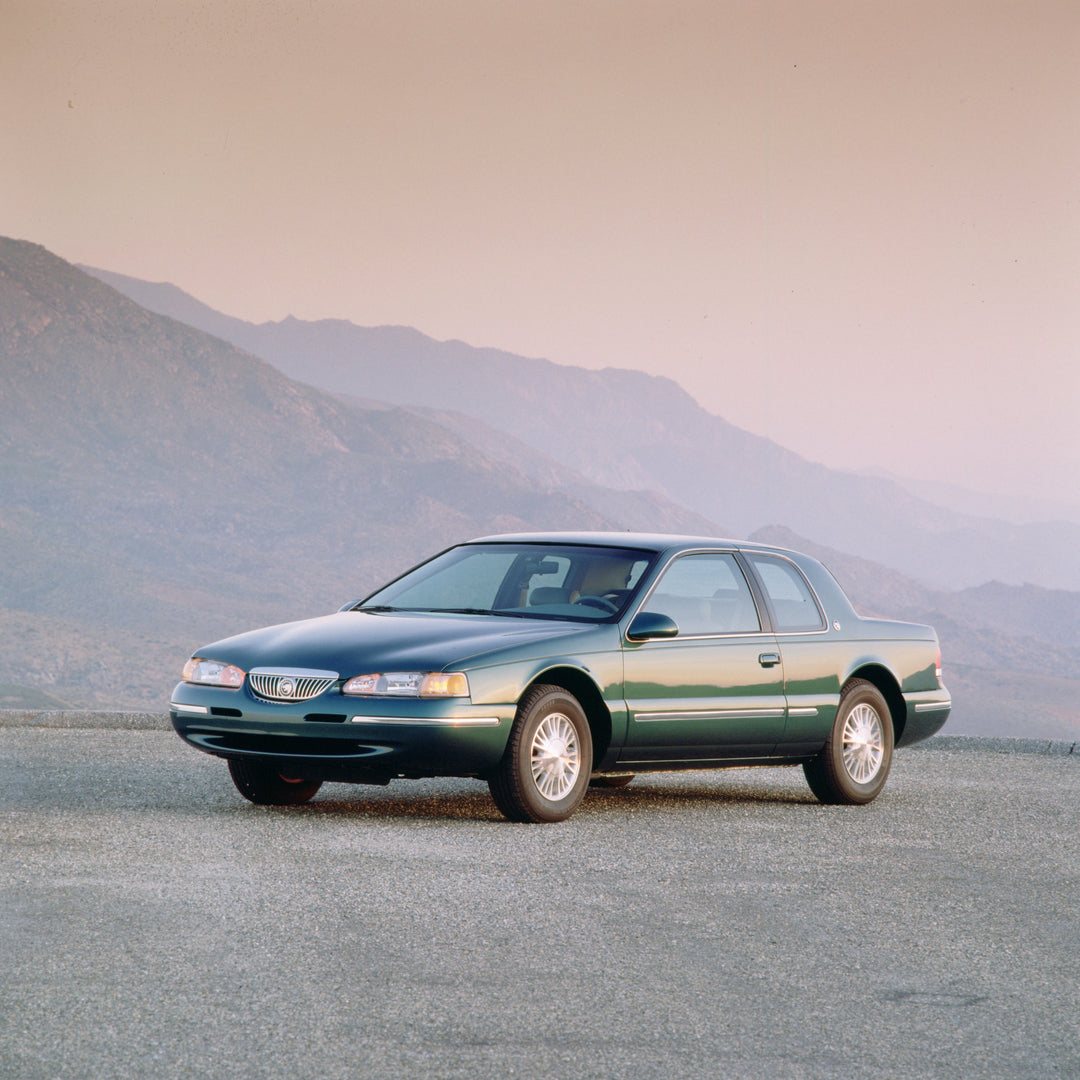 This archival image documents the 1997 Mercury Cougar XR-7 with Mountains in Background and is preserved in the Ford Heritage Vault as part of Ford Motor Company's historic photographic archive. Free for personal, non-commercial use. Ford Heritage...