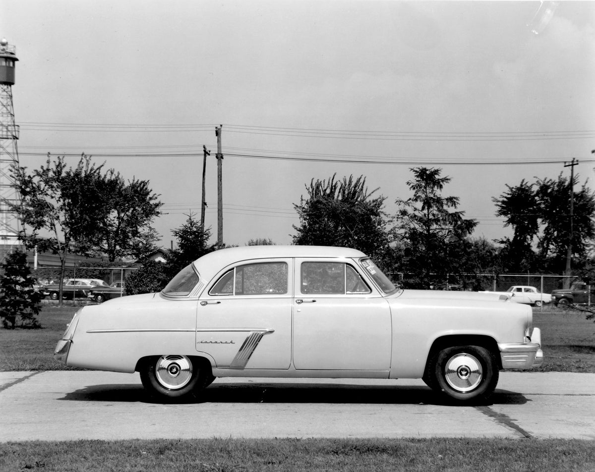 This archival image documents the 1952 Monarch Sedan side view on scenic road AR-2007-5 and is preserved in the Ford Heritage Vault as part of Ford Motor Company's historic photographic archive. Free for personal, non-commercial use. Ford Heritage...