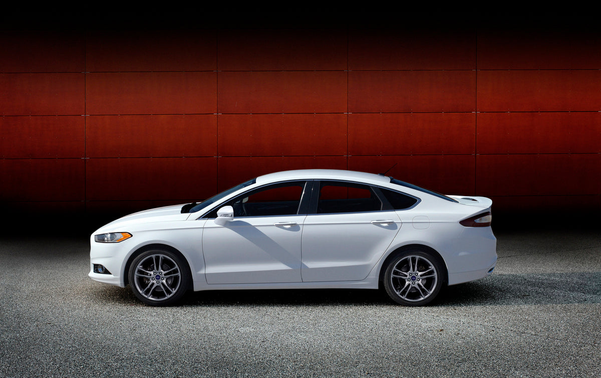 This archival image documents the 2014 Ford Fusion Titanium in front of wall and is preserved in the Ford Heritage Vault as part of Ford Motor Company's historic photographic archive. Free for personal, non-commercial use. Ford Heritage Vault refe...