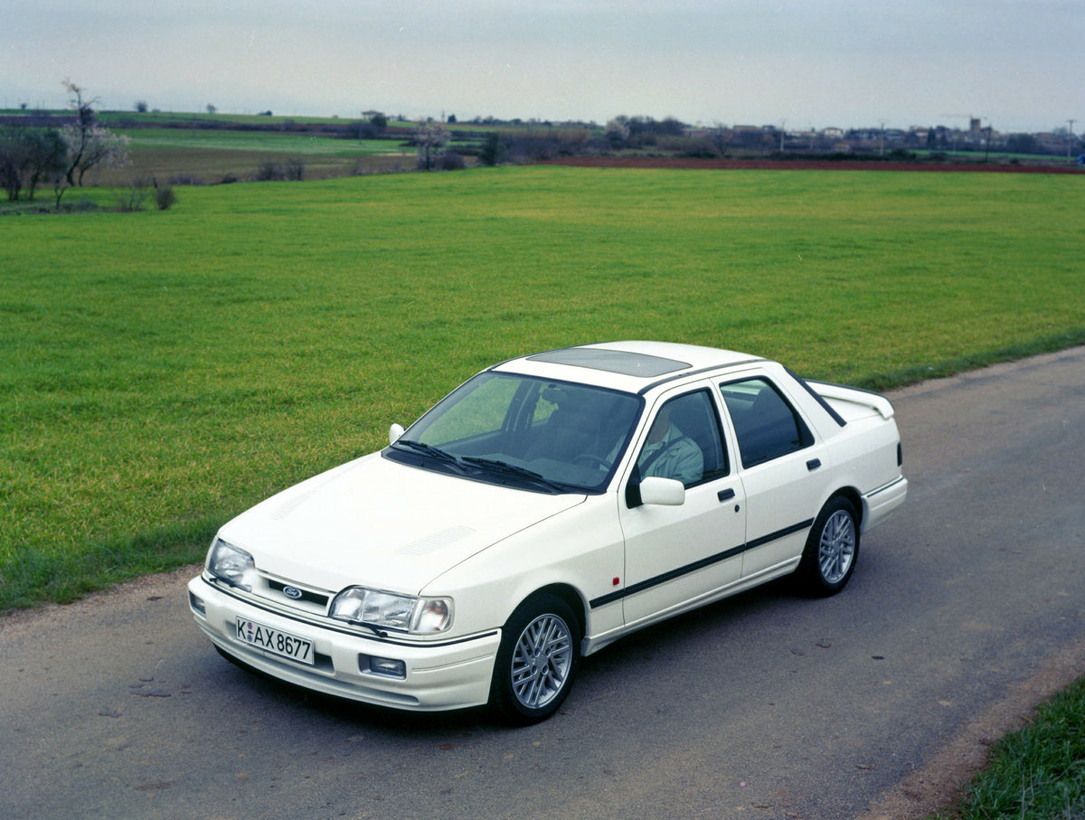 This archival image documents the 1990 Ford Sierra 90.5 LHD on scenic road in Spain and is preserved in the Ford Heritage Vault as part of Ford Motor Company's historic photographic archive. Free for personal, non-commercial use. Ford Heritage Vau...