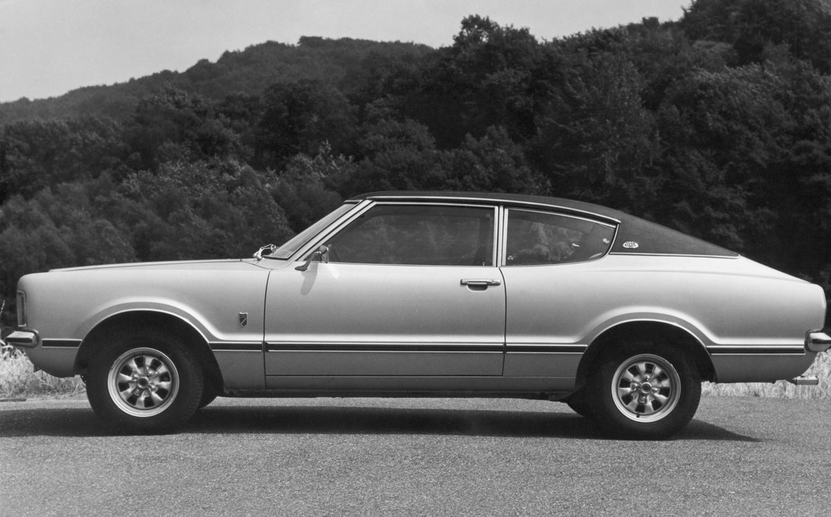 This archival image documents the 1973 Ford Taunus GXL side view with scenic trees and is preserved in the Ford Heritage Vault as part of Ford Motor Company's historic photographic archive. Free for personal, non-commercial use. Ford Heritage Vaul...