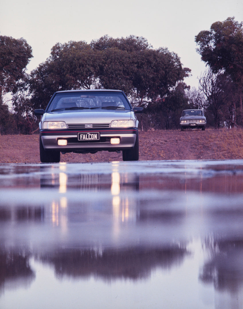 This archival image documents the 1985 Ford XF Falcon 25th Anniversary Edition Sedan Front End View on Country Road FAP-2011-3 and is preserved in the Ford Heritage Vault as part of Ford Motor Company's historic photographic archive. Free for pers...
