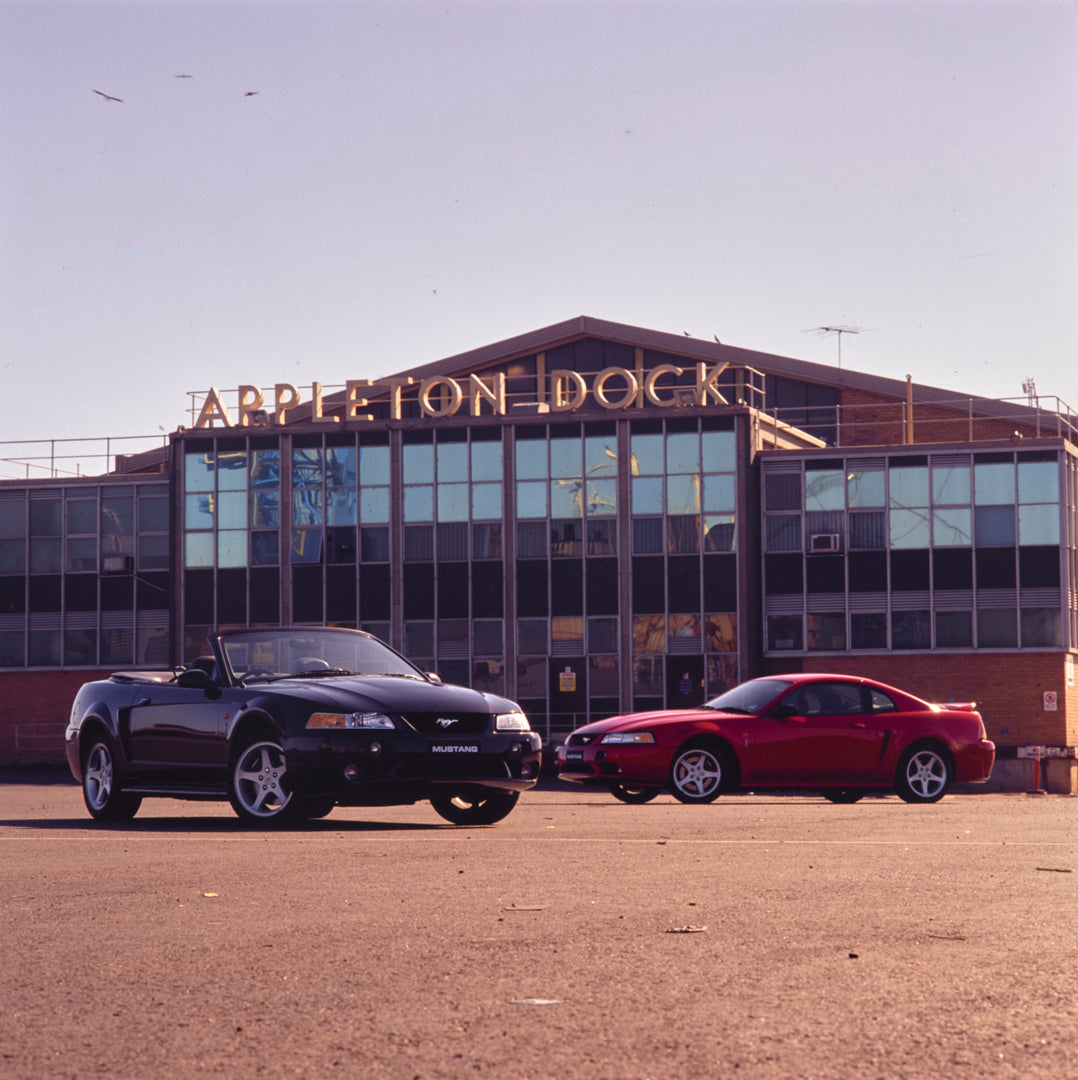 This archival image documents the 2004 Ford Mustang Coupe and Convertible in Parking Lot FAP-2011-3 and is preserved in the Ford Heritage Vault as part of Ford Motor Company's historic photographic archive. Free for personal, non-commercial use. F...