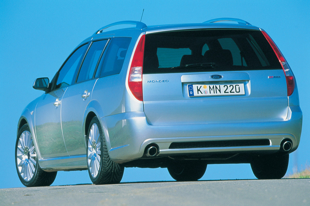 This archival image documents the 2002 Ford Mondeo ST220 Mark II rear view with scenic blue sky and is preserved in the Ford Heritage Vault as part of Ford Motor Company's historic photographic archive. Free for personal, non-commercial use. Ford ...