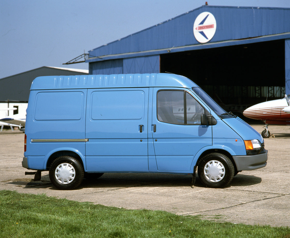 This archival image documents the 1991 Ford Transit Mark III LCX Semi High Roof LHD side view near hangar and is preserved in the Ford Heritage Vault as part of Ford Motor Company's historic photographic archive. Free for personal, non-commercial ...