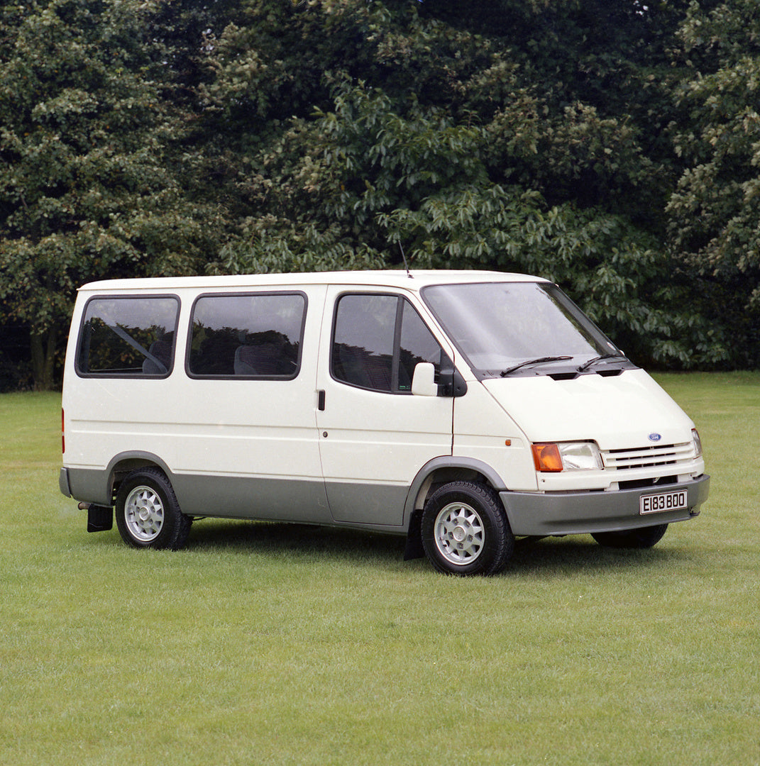 This archival image documents the 1988 Ford Transit Mark III Ghia Bus in scenic field with trees and is preserved in the Ford Heritage Vault as part of Ford Motor Company's historic photographic archive. Free for personal, non-commercial use. Ford...