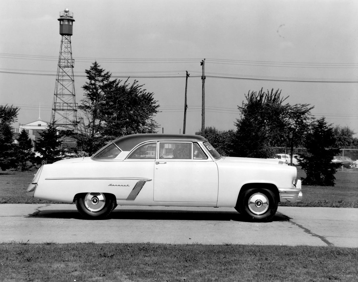 This archival image documents the 1952 Monarch Coupe side view on scenic road AR-2007-5 and is preserved in the Ford Heritage Vault as part of Ford Motor Company's historic photographic archive. Free for personal, non-commercial use. Ford Heritage...