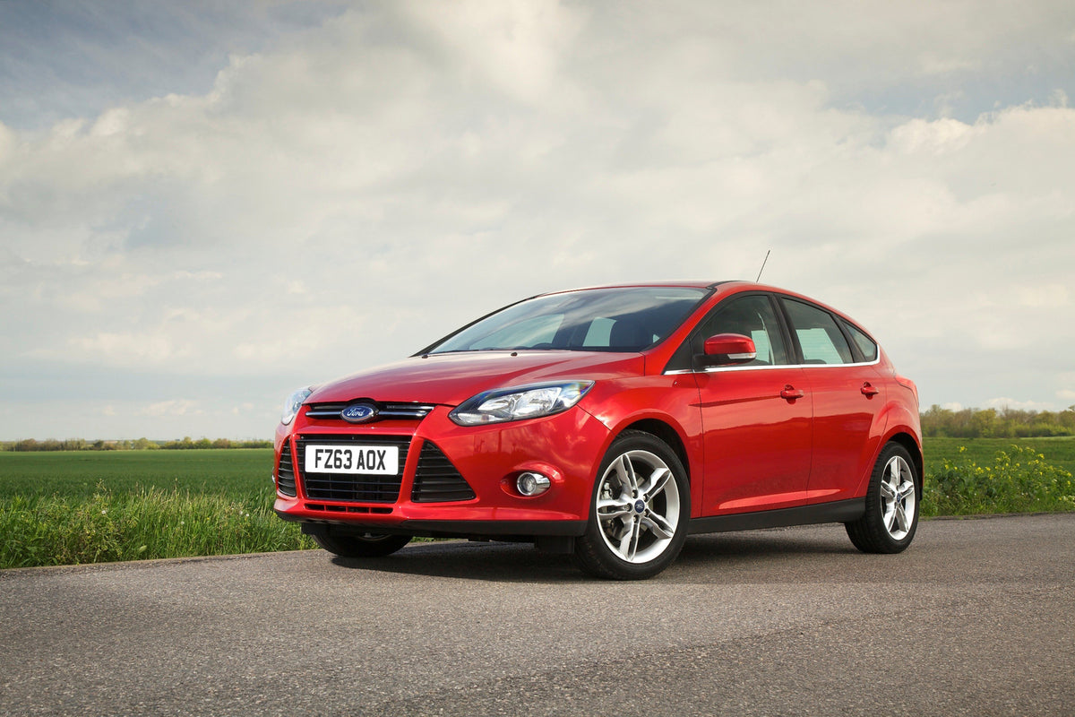 This archival image documents the 2013 Ford Focus Mark III on scenic road and is preserved in the Ford Heritage Vault as part of Ford Motor Company's historic photographic archive. Free for personal, non-commercial use. Ford Heritage Vault referen...