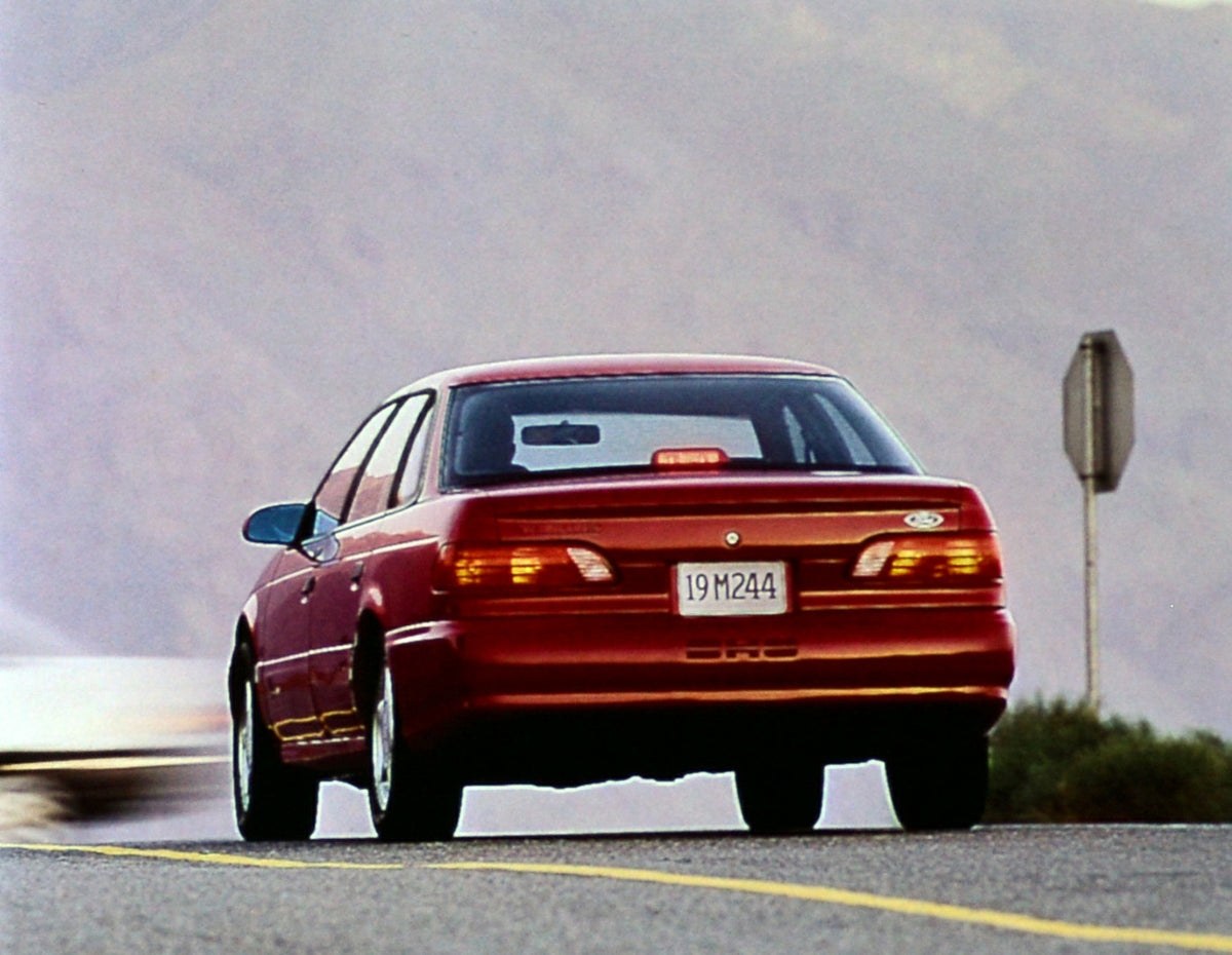 This archival image documents the 1992 Ford Taurus four-door and is preserved in the Ford Heritage Vault as part of Ford Motor Company's historic photographic archive. Free for personal, non-commercial use. Ford Heritage Vault reference AR-2001-94...