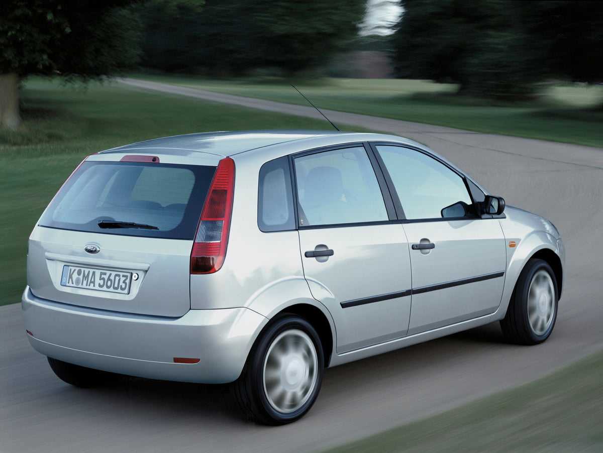 This archival image documents the 2002 Ford Fiesta Mark V rear view action shot on scenic road with trees and is preserved in the Ford Heritage Vault as part of Ford Motor Company's historic photographic archive. Free for personal, non-commercial ...