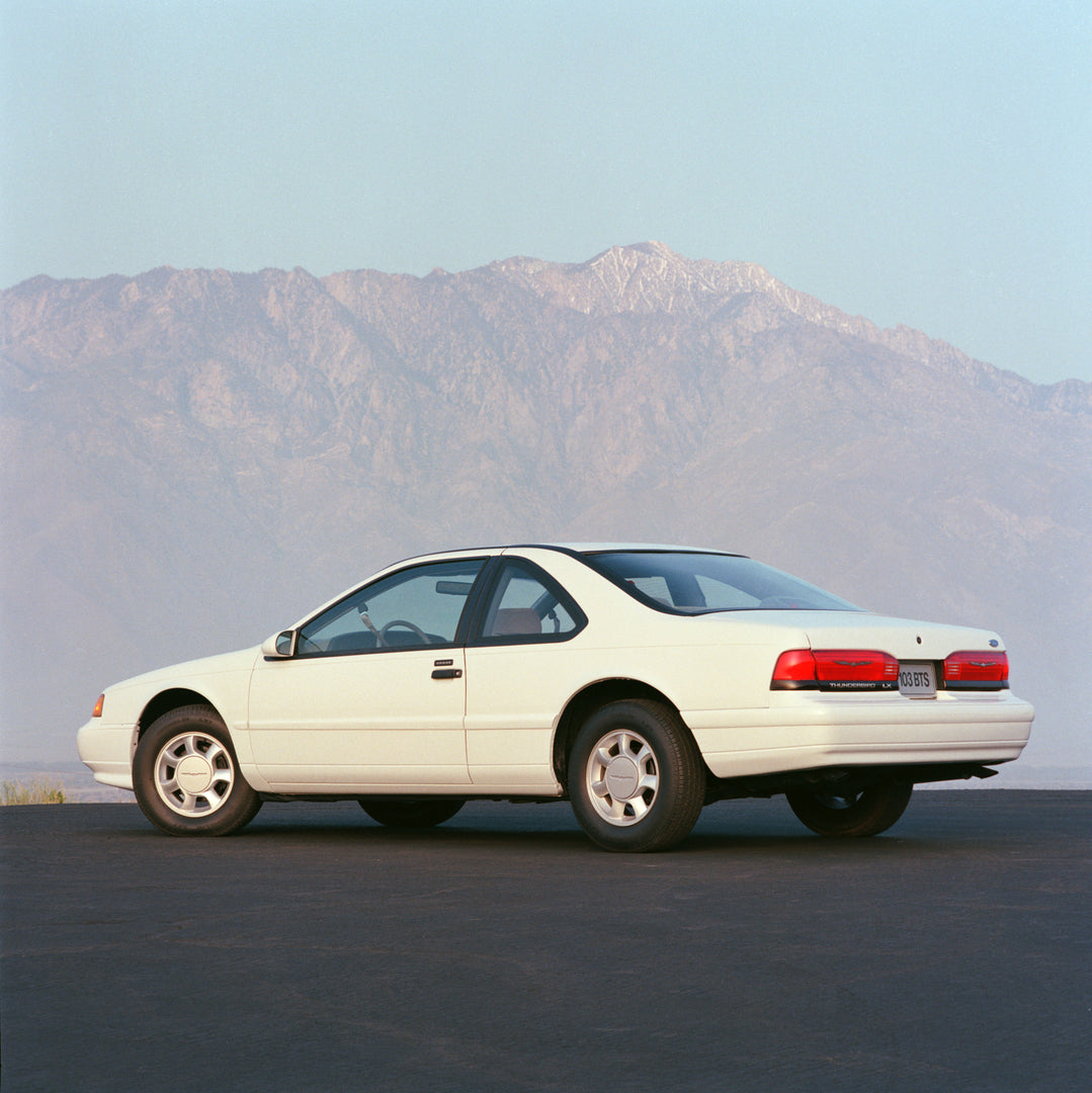 This archival image documents the 1993 Ford Thunderbird LX scenic in mountains and is preserved in the Ford Heritage Vault as part of Ford Motor Company's historic photographic archive. Free for personal, non-commercial use. Ford Heritage Vault re...