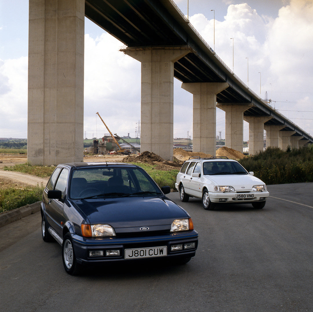 This archival image documents the 1991 Ford Fiesta Mark III and Sierra Estate on road by Thurrock Bridge and is preserved in the Ford Heritage Vault as part of Ford Motor Company's historic photographic archive. Free for personal, non-commercial u...