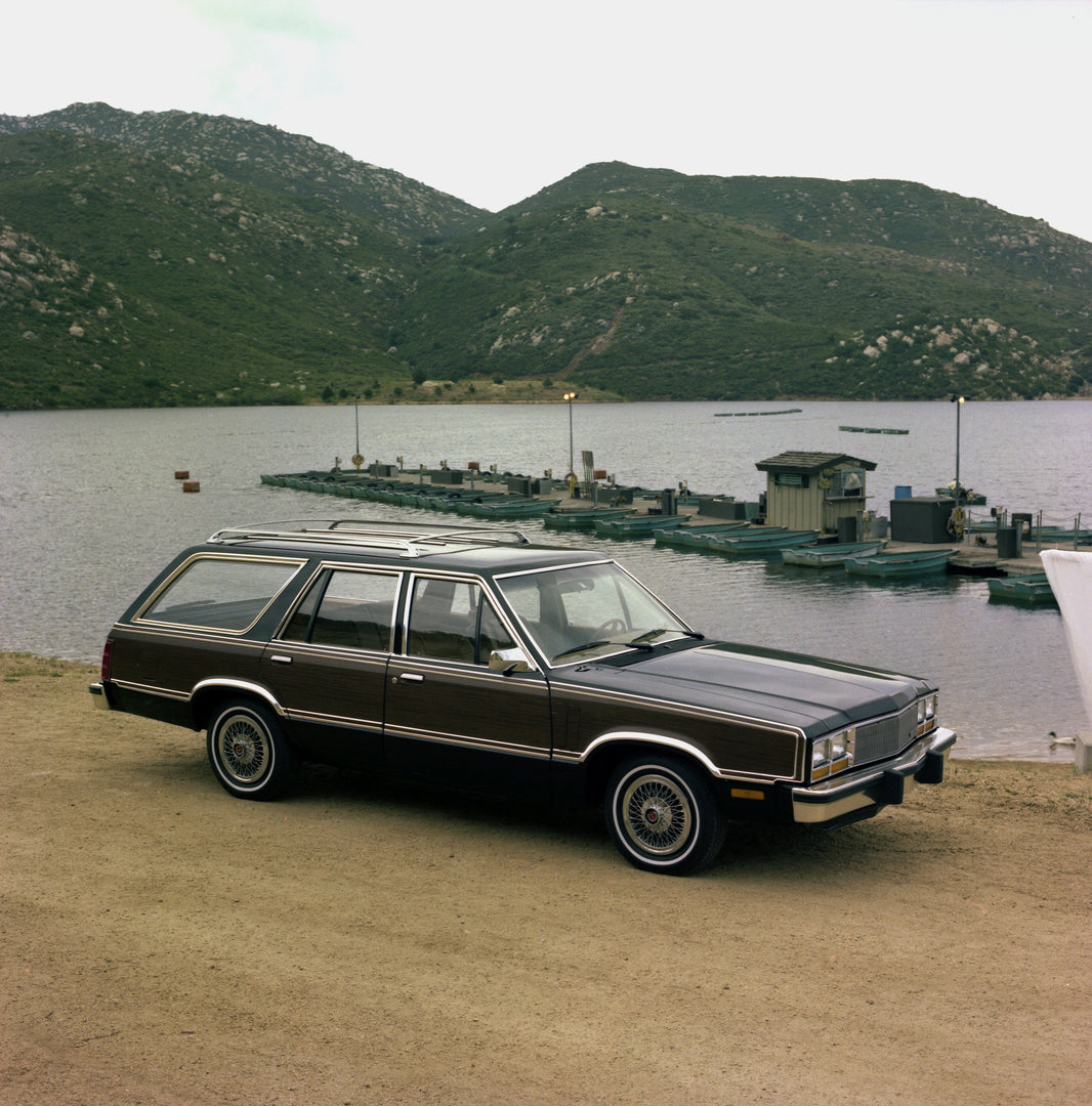 This archival image documents the 1981 Mercury Zephyr Wagon with Boat Dock and Mountain in Background and is preserved in the Ford Heritage Vault as part of Ford Motor Company's historic photographic archive. Free for personal, non-commercial use....