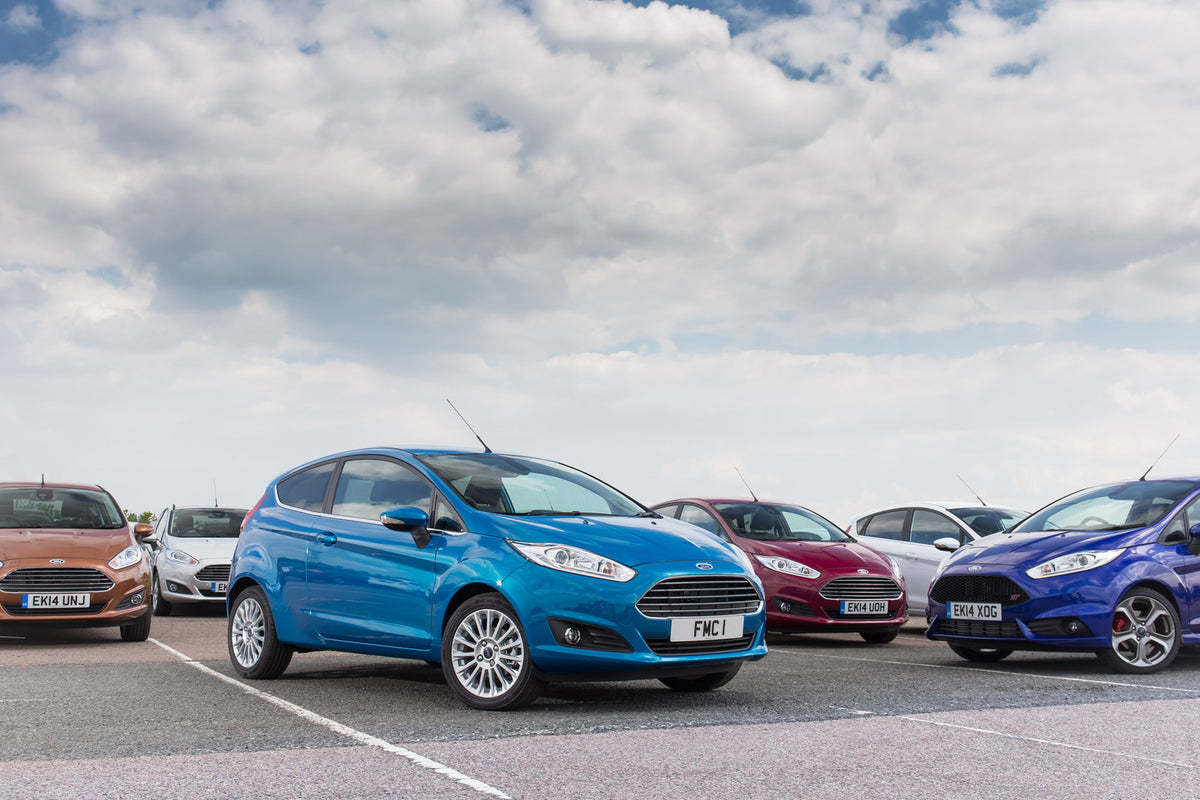 This archival image documents the 2014 Ford Fiesta Mark VIs in parking lot and is preserved in the Ford Heritage Vault as part of Ford Motor Company's historic photographic archive. Free for personal, non-commercial use. Ford Heritage Vault refere...