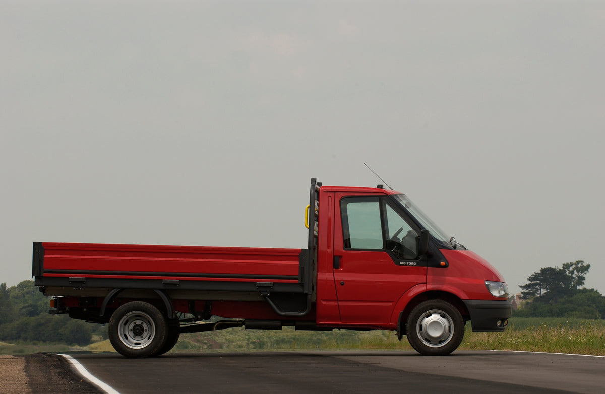 This archival image documents the 2003 Ford Transit Mark IV pickup side view on scenic road and is preserved in the Ford Heritage Vault as part of Ford Motor Company's historic photographic archive. Free for personal, non-commercial use. Ford Heri...
