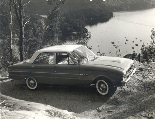 1962 Ford XL Falcon with trees overlooking scenic body of water HV 1962-0095