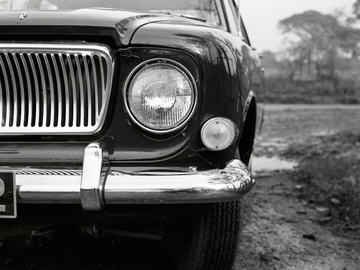 This archival image documents the 1962 Ford Zephyr 5 Mark III headlight closeup on scenic road in Aveley and is preserved in the Ford Heritage Vault as part of Ford Motor Company's historic photographic archive. Free for personal, non-commercial u...