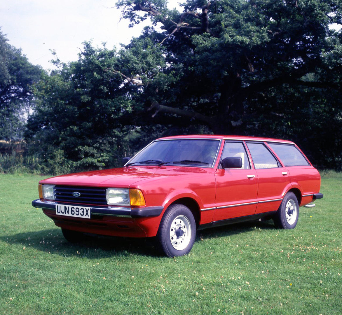 This archival image documents the 1981 Ford Cortina Estate 1.6L in scenic field with trees and is preserved in the Ford Heritage Vault as part of Ford Motor Company's historic photographic archive. Free for personal, non-commercial use. Ford Herit...