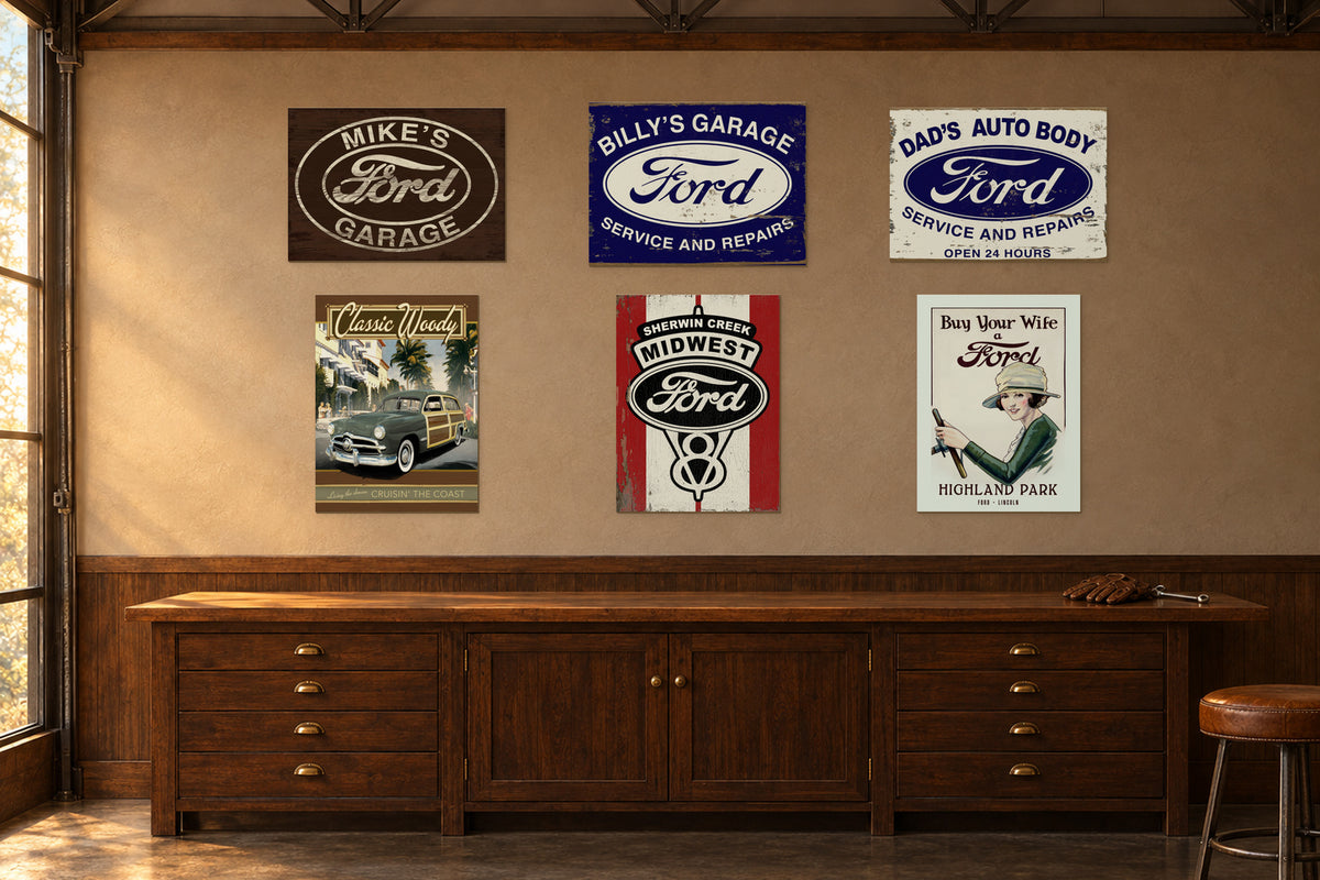 Custom Ford wood signs displayed above a vintage wooden garage workbench